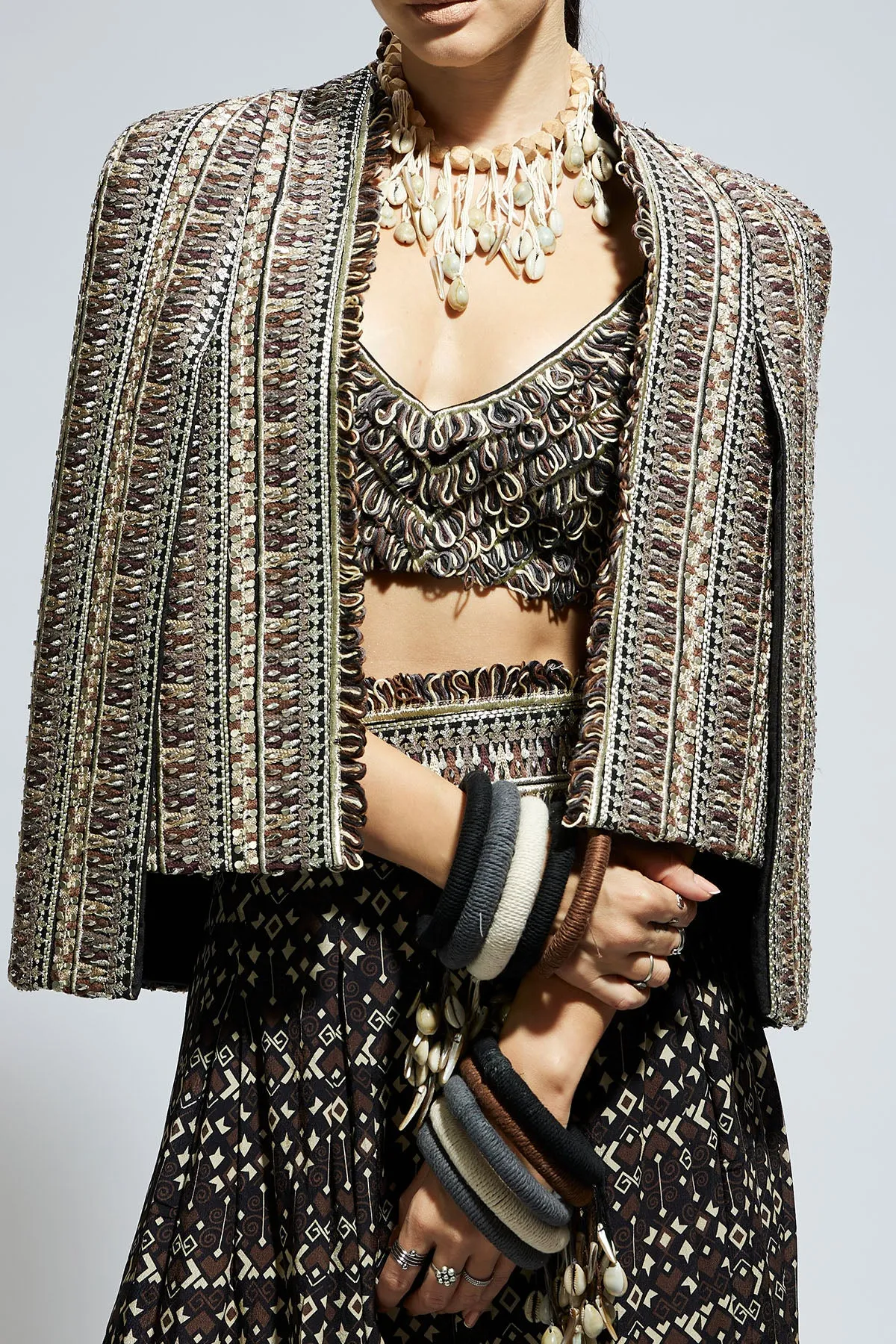 Brown Threadwork Cape Jacket Paired with Textured Bustier and Flared Pants