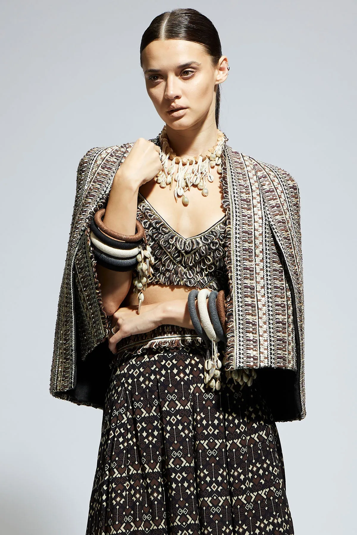 Brown Threadwork Cape Jacket Paired with Textured Bustier and Flared Pants