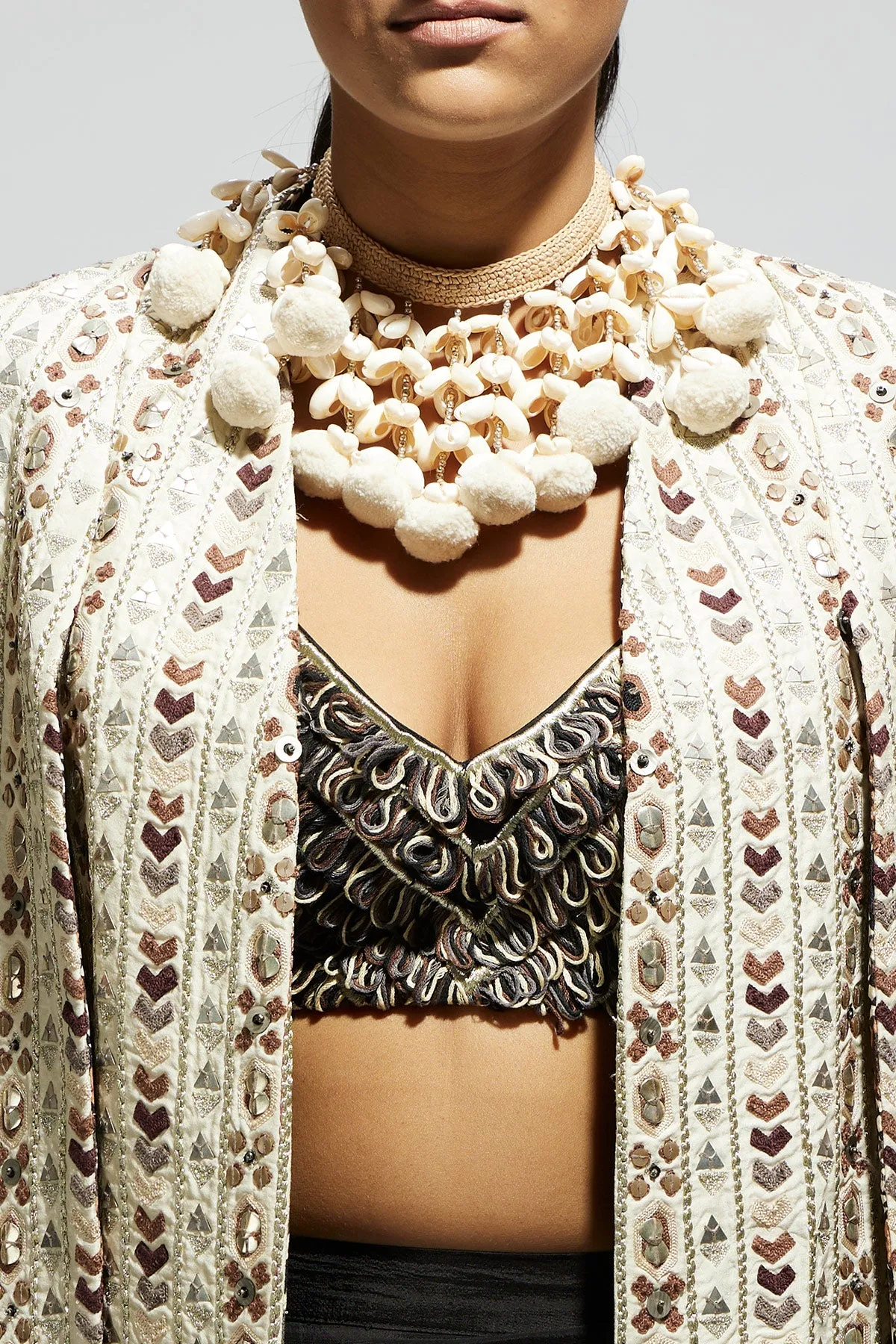 Ivory Embellished Cape Jacket Paired with Textured Bustier and Drape Skirt